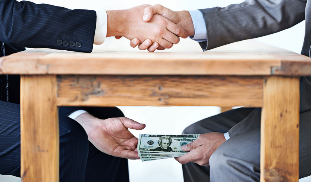BLOG-1024x600-money-under-the-table-PeopleImages-iStock-477514725.jpg